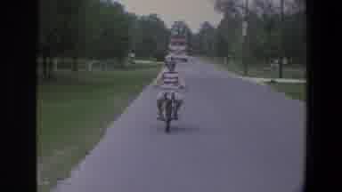 Minnesota (1973): Young Woman Tests Out Her Motorbike And Wears Her Helmet And