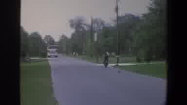 Minnesota (1973): Fire Truck Bicycle And Motorcycle Going Down A Street In The