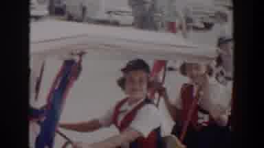 Lubbock Texas (1958): View Of Campfire Girls Sitting In White Cart On A Sunny Day