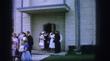 Moberly Missouri (1962): People Prepare To Go Home After A Mass