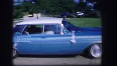 Moberly Missouri (1962): Blue Car Passes Open Top Car Full Of Young Adults