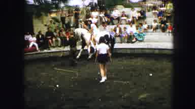 Austria-1963: Two Girls Wearing White Dresses Ride A Horse With Fans Watching