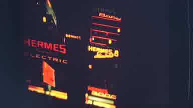 ZURICH SWITZERLAND-1963: Night Time Film Outside Buildings Hermes Electric Signs