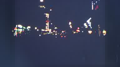 ZURICH SWITZERLAND-1963: A City Well Lit At Night With Many People Going In And