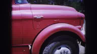 Dallas Texas-1964: Close-Up Of Red Truck With Black Tire On A Sunny Day