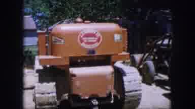 Dallas Texas (1964): View Of Orange Parked Tractor On A Bright Sunny Day