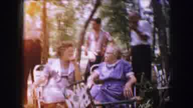 Dallas Texas (1964): Two Older Women Sitting And Talking In Lawn Chairs Outside