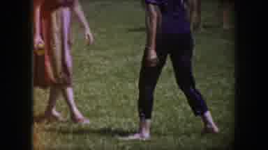 Dallas Texas-1964: Woman Walking Barefoot On Grass With A Man