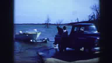 Fort Worth Texas (1964): People In A Pickup Truck Pulling A Boat Onto Shore With A