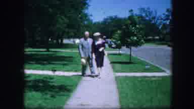 Fort Worth Texas (1964): Well Dressed Couple Walking On A Sidewalk