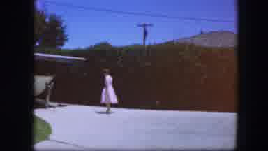 Fort Worth Texas (1964): A Woman In A White Dress Picks An Object From The Canopy