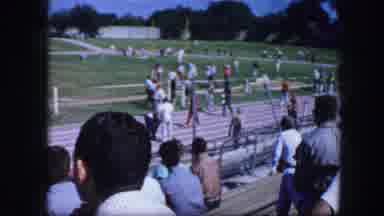 Fort Worth Texas (1964): Person Wearing Black Shorts Runs Down Long Jump Track On