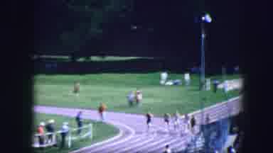 Fort Worth Texas (1964): Athletes Perform A Race While The People Around Them