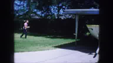 Lewisville Texas (1965): A Man Walking In His Yard With Mon Grass And A Boat