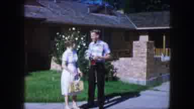Lewisville Texas (1965): Couple Walks Across The Grass On A Sunny Day The Man