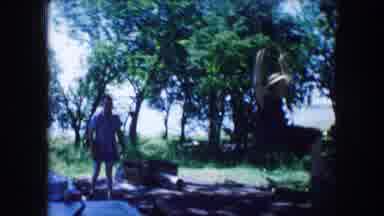 Lewisville Texas (1965): Two Adults Having Fun Swinging Each Other Near A Big