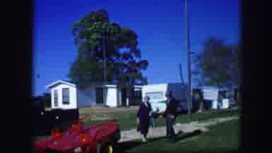 Kirksville Missouri (1967): A Man Walks His Woman As She leaves For Work