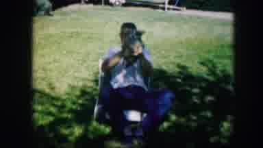 Kirksville Missouri (1967): A Guy And His Girlfriend Both Play With Puppies In