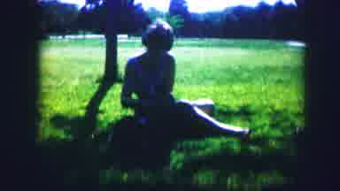 Kirksville Missouri (1967): Woman Sitting In The Park In The Grass Playing With