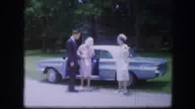 Kirksville Missouri (1967): Two Women And A Man In Front Of A Vintage Car