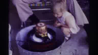 Denver Colorado (1973): Small Kid Watching Rotating Machine With Grandfather And