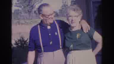 Sarasota Florida (1969): Elderly Couple Stands Near Tan House On A Bright Sunny