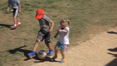 SAN JOSE DEL CABO MEXICO-2019: Children Kicking A Soccer Ball Playing Together