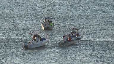 GRAND JUNCTION COLORADO-2017: People In Fishing Boats Out At Sea With Waves