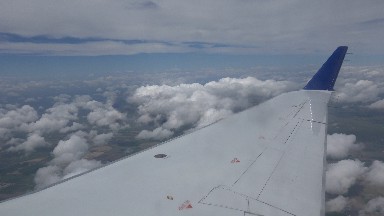 WINNIPEG CANADA-2015: Plane Above The Clouds Filmed From Inside Through The Window