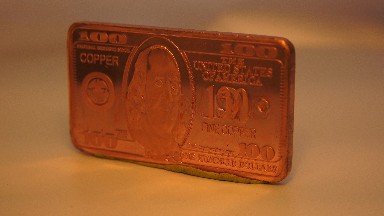 A Golden Version Of A Hundred Dollar Bill Is Spinning Around In A Circle