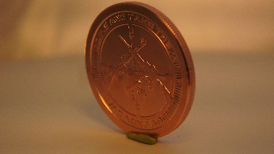 Watch This Amazing Bronze Penny Spin On This Table Forever