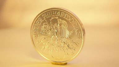 Golden Shiny Coin Rotating Yellow Background Reflecting Light Written Words