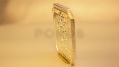 A Seemingly Gold Coin Turning Continuously To The Left