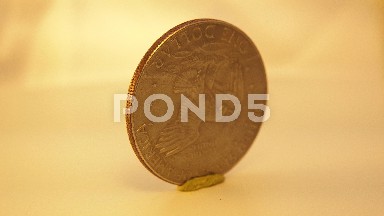 Eagle On A One Dollar Coin Of United State Of America Rounding On A Surface