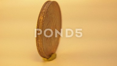 A Chinese Currency Coin Spins Around In Very Slow Motion