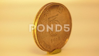 Gold Five Dollar Coin With Markings On It
