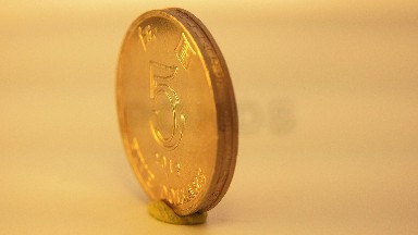 Shiny Five Dollars Coin From Flips Showing Two Faces