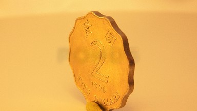 A Rotating Coin With A Number On One Side While The Other Coin Is Not