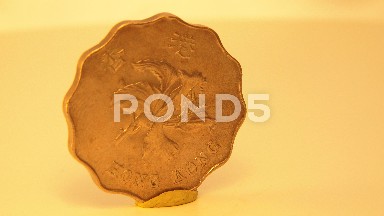 Foreign Coin Rotates On Stand