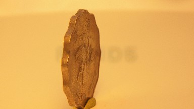 A Coin On A Table Spinning Around