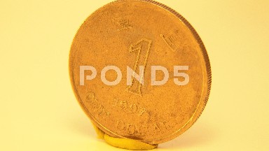 Old Antique Golden Coin Display Rotating From Dollar Cent