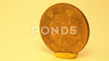 A Coin On A Table Spinning In A Circle