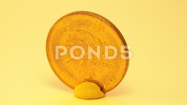 Old Gold Coin Running On The Axis Itself