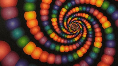An Optical Illusion Of A Rainbow Amount Of Colors Of Balls Spinning In A