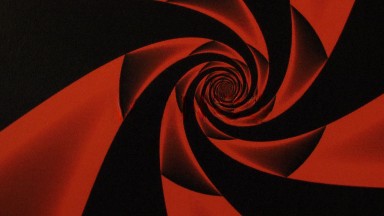 A Pattern Of Red And Black Swirls In A Vortex About The Center Of The Video