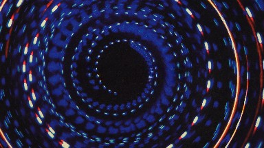 Red White And Blue Pattern On Black Background Twirls On Screen