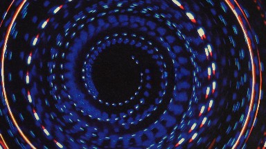 Rotating Swirly Shape Reminiscent Of A Black Hole Mesmerizes On The Screen