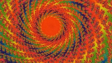 A Many Shapes Of Many Colors Moving In A Circular Shape In A Kaleidoscope