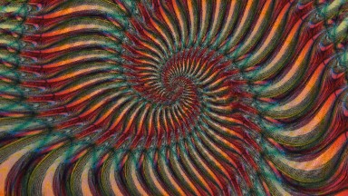 Psychedelic Video Showing A Twirling Picture Of Red Yellow And Green