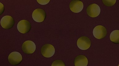A Weird Background With Green Balls Rotating Around In A Clockwise Motion